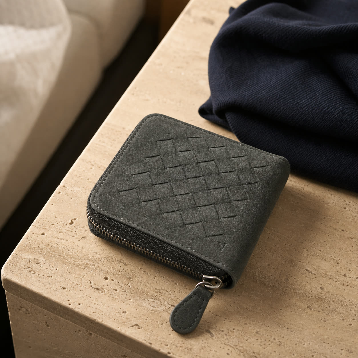 Graphite Virela zip travel wallet on warm travertine